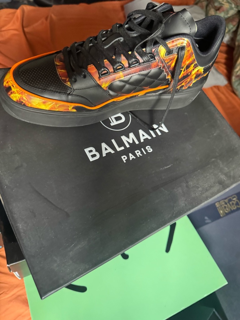 Balmain Men’s Black Leather Sneakers with Fiery Orange Flame Print